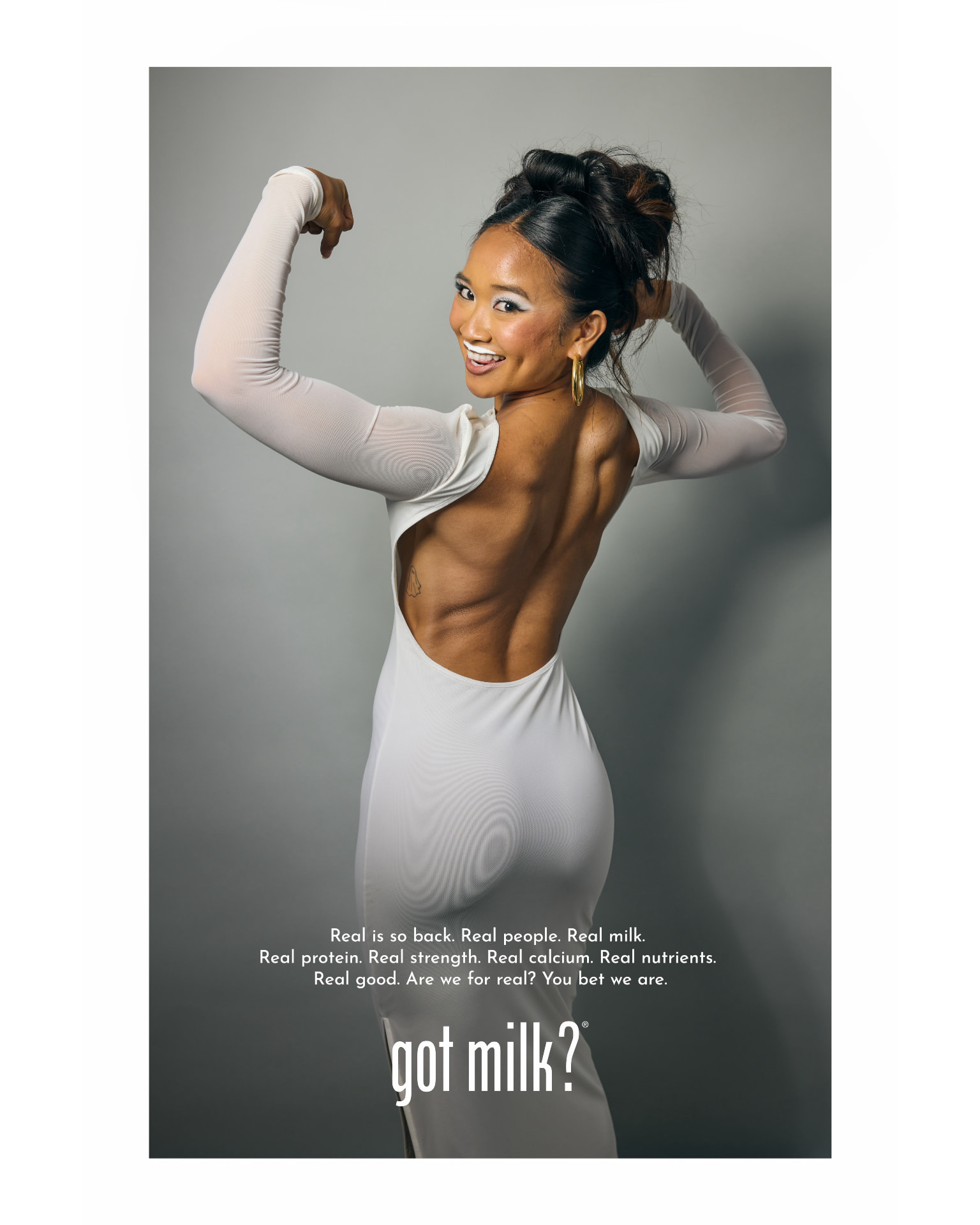 Kamryn Hernandez in a white backless gown flexing for a national got milk? campaign print ad