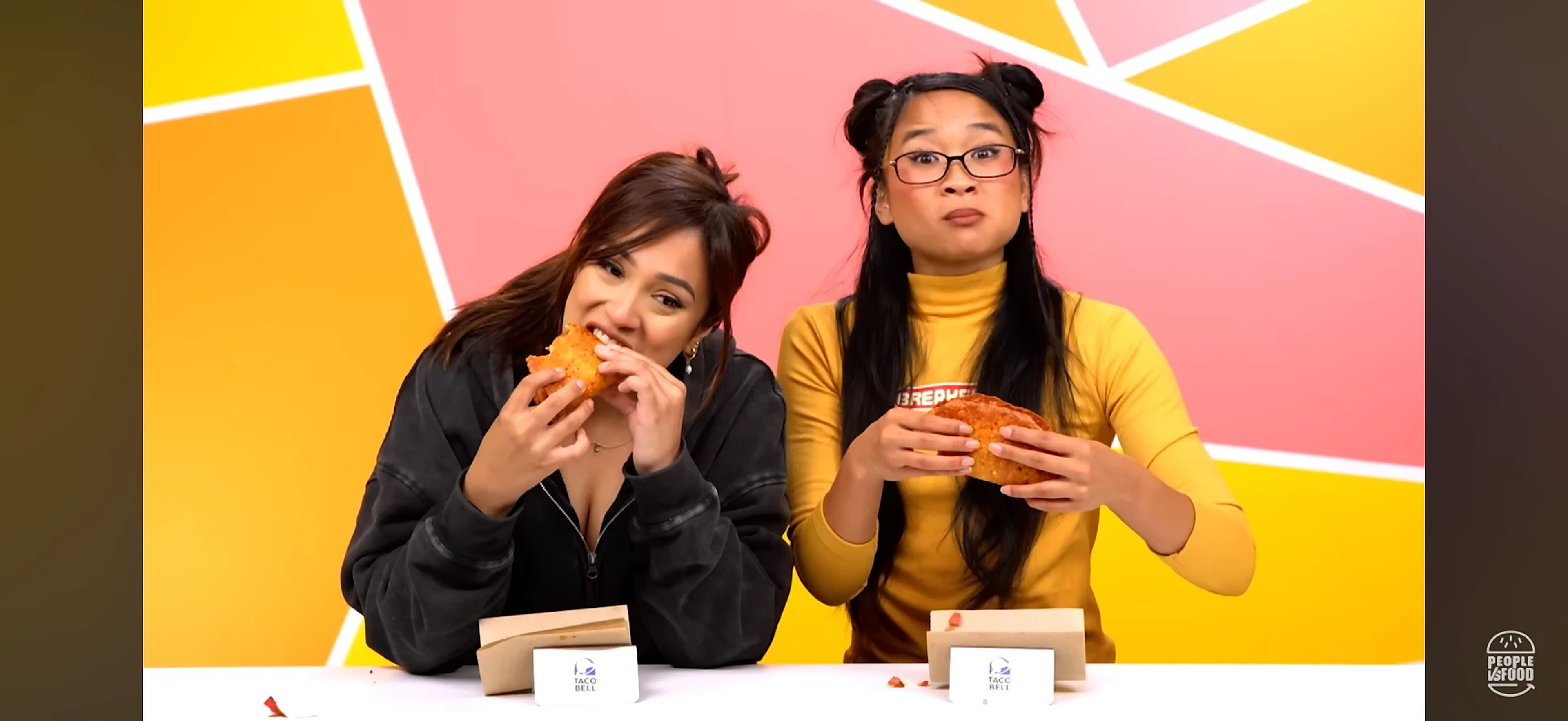 Kamryn Hernandez tasting a Taco Bell item alongside a co-host on People vs. Food
